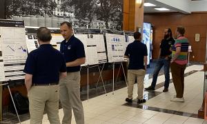 Poster Session:  Group shots of JANUS members viewing posters