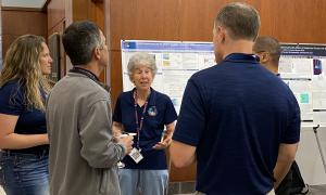 Poster Session:  Group shots of JANUS members viewing posters