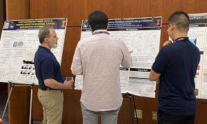 Poster Session:  Group shots of JANUS members viewing posters
