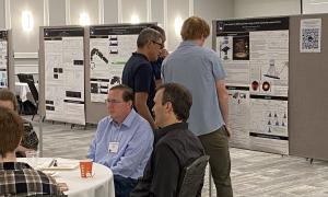 Poster Session:  Group shots of JANUS members viewing posters